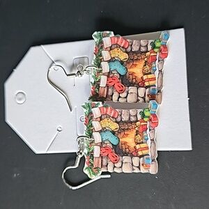 Christmas dangle earrings, fireplace with stockings hanging off it.